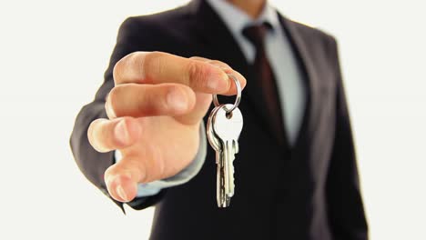 Businessman-Handing-Keys-Of-House-Real-Estate