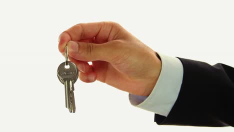 Businessman-Handing-Keys-Of-House