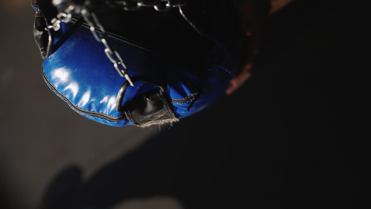 Premium stock video Boxer hitting punching bag