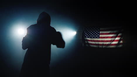Wide-view-of-fighter-training-against-backdrop-of-American-flag