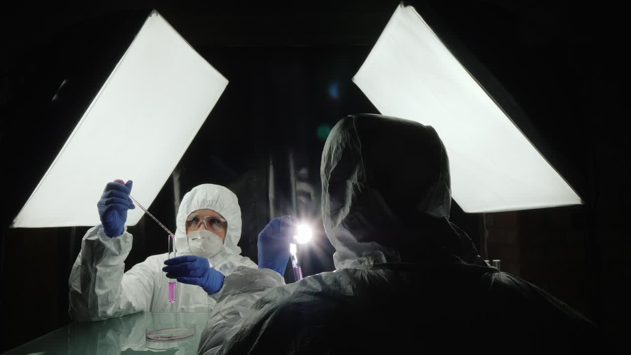 Premium stock video Two researchers work in the laboratory developing new drugs