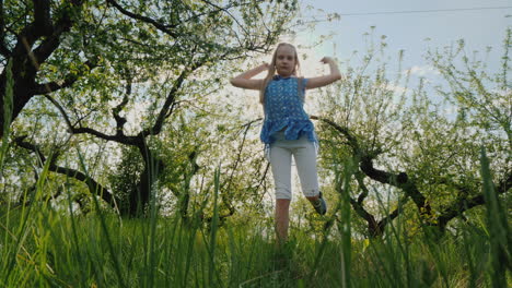 Funny-Girl-Dances-In-The-Apple-Orchard-In-The-Sun