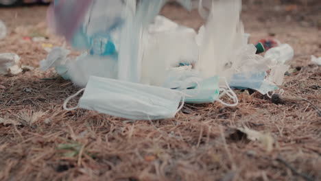 Medical-masks-and-plastic-lies-on-the-ground-in-the-forest-1
