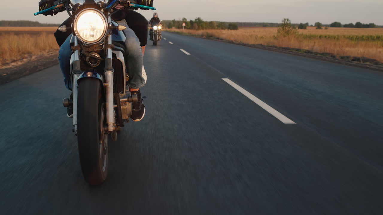 Premium stock video - A group of bikers rides along the highway in a row 2