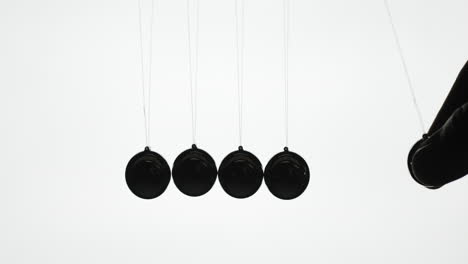 The-Silhouette-Of-Newton's-Cradle---A-Series-Of-Metal-Balls-Demonstrating-The-Law-Of-Energy-Conservation