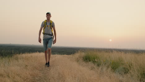 Person-Walking-On-A-Field-Road