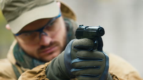 A-man-plays-airsoft-with-a-pistol-in-his-hand-4
