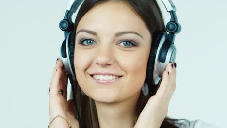 A-young-woman-listens-to-music-with-headphones