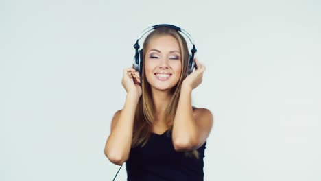 A-young-woman-listens-to-music-with-headphones-3