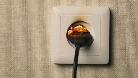 A-flame-appears-in-a-plug-outlet-1