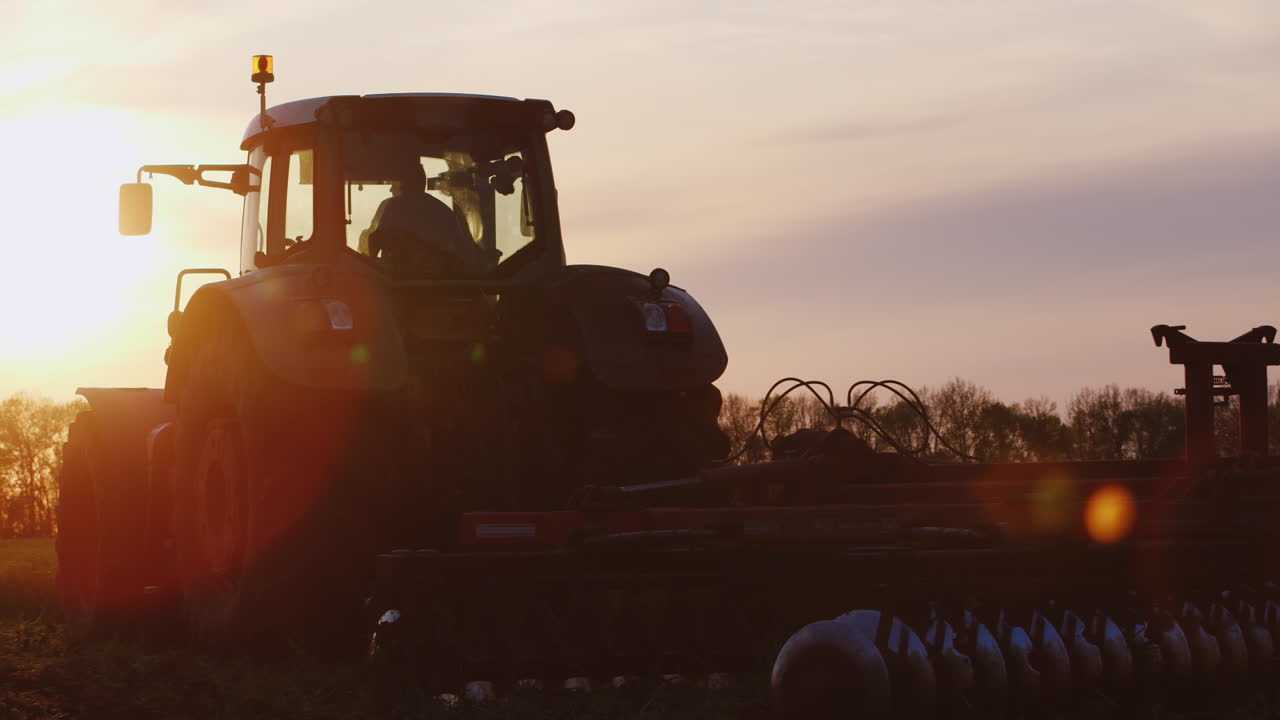 Premium stock video Tractor plows through the soil 9