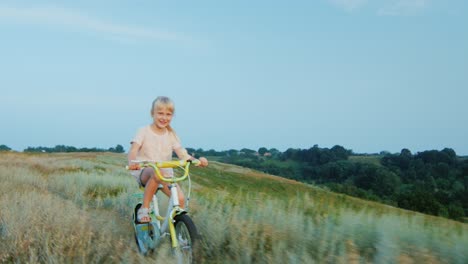 A-cheerful-girl-rides-a-bike-in-the-countryside