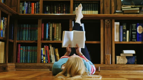 Young-Woman-Lying-Down-Reading-A-Book-1