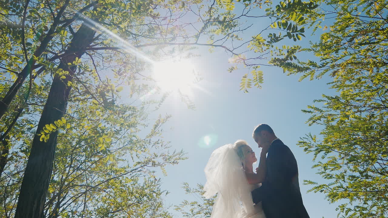 romantic wedding couple bathing in the sun