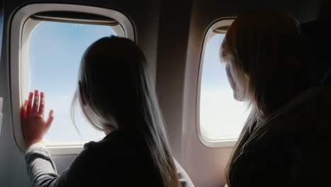 Mom-And-Daughter-In-The-Airplane-1
