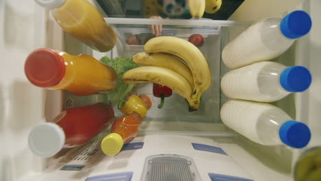 The-Child-Takes-Out-A-Banana-From-The-Refrigerator