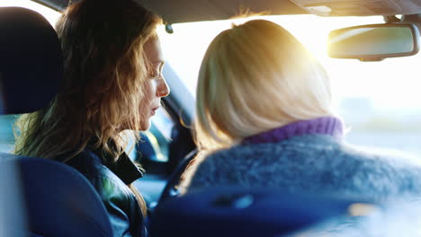 Two-Women-Communicate-Inside-The-Car