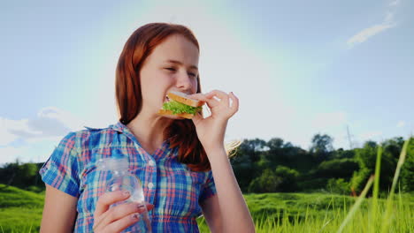 Portrait-Of-A-Teenage-Girl-Eating-A-Sandwich-1