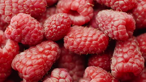 Juicy-Red-Raspberries-Spin-On-White-Background