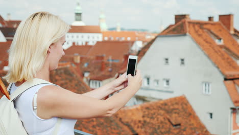A-Woman-Tourist-Takes-Pictures-Of-The-Old-Part-Of-The-Beautiful-City-Of-Graz