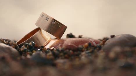 Wedding-rings-on-stones-against-the-background-of-the-sea